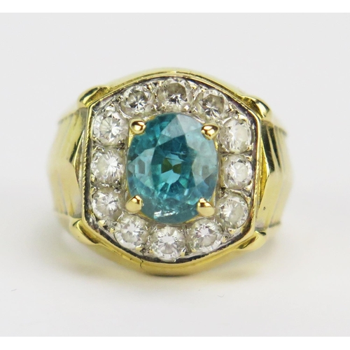 31 - A Topaz and Diamond Ring in a precious yellow metal setting, 7.7x6.3mm principal stone, surrounded b... 