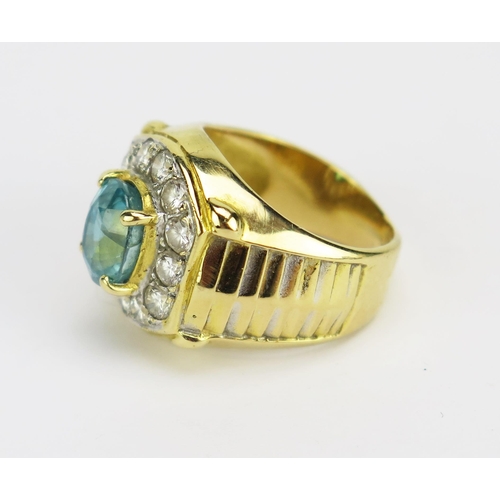 31 - A Topaz and Diamond Ring in a precious yellow metal setting, 7.7x6.3mm principal stone, surrounded b... 