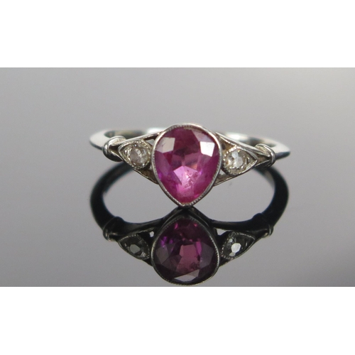 311 - A Ruby and Old Cut Diamond Three Stone Ring in a precious white metal millegrain setting, c. 6.3x5.4... 