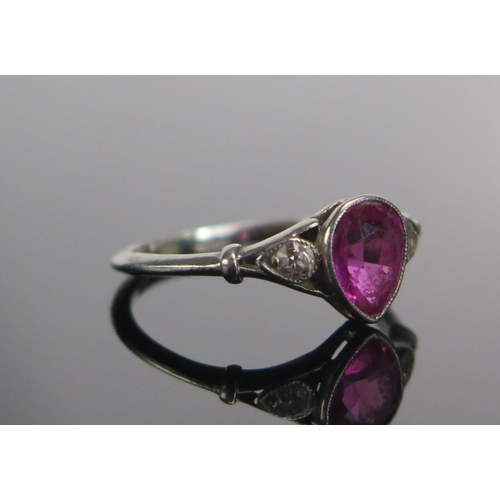 311 - A Ruby and Old Cut Diamond Three Stone Ring in a precious white metal millegrain setting, c. 6.3x5.4... 