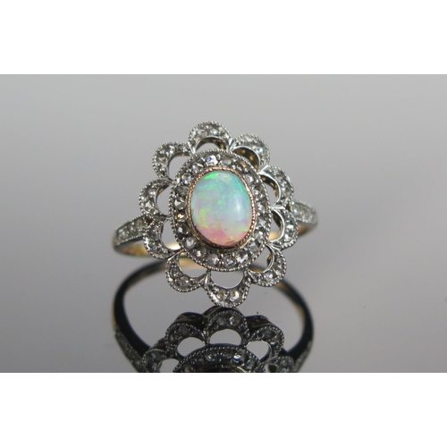 317 - An 18ct Gold, Opal and Old Cut Diamond Ring, 7.2x5.6mm principal stone, 18.25x15.25mm head, size N.5... 