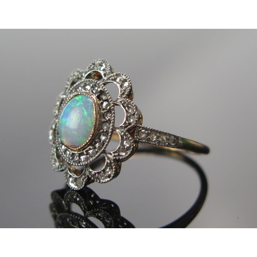 317 - An 18ct Gold, Opal and Old Cut Diamond Ring, 7.2x5.6mm principal stone, 18.25x15.25mm head, size N.5... 