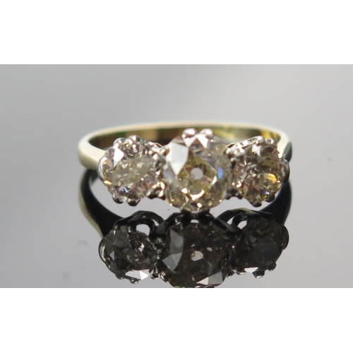 318 - An Old Cut Diamond Three Stone Ring in a high carat precious yellow metal setting, c. 6.2x5.4mm prin... 