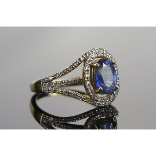 320 - An 18ct Gold, Sapphire and Diamond Cluster Ring, 8.1x6mm principal stone, size N, hallmarked, 4.72g