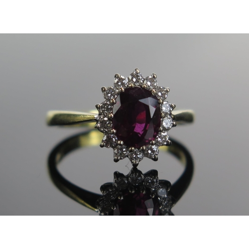 322 - An 18ct Gold, Ruby and Diamond Cluster Ring, 7.5x6.3mm principal stone, 12.46x10.5mm head, size N.5,... 