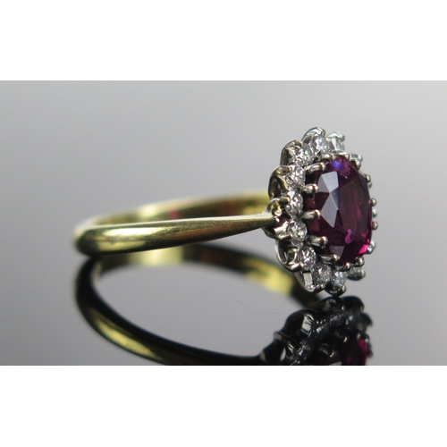 322 - An 18ct Gold, Ruby and Diamond Cluster Ring, 7.5x6.3mm principal stone, 12.46x10.5mm head, size N.5,... 