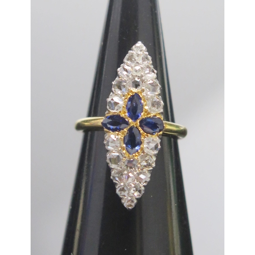 326 - A Sapphire and Rose Cut Diamond Marquis Ring in a high carat precious yellow metal setting, size K.7... 