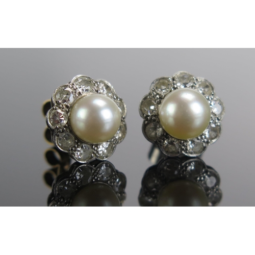 330 - A Pair of Cultured Pearl and Diamond Cluster Stud Earrings in a precious white metal setting, 11.7mm... 