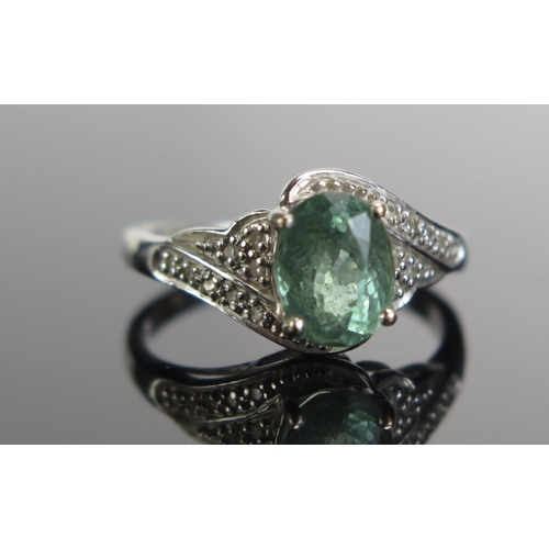 333 - An 18ct White Gold, Tourmaline and Diamond Ring, 8.1x6.2mm principal stone, size M.75, 4.05g