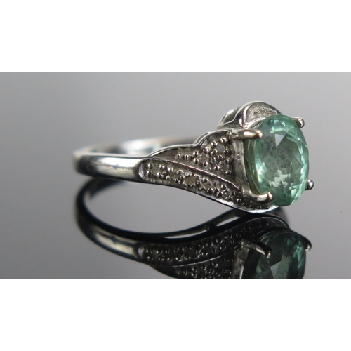 333 - An 18ct White Gold, Tourmaline and Diamond Ring, 8.1x6.2mm principal stone, size M.75, 4.05g