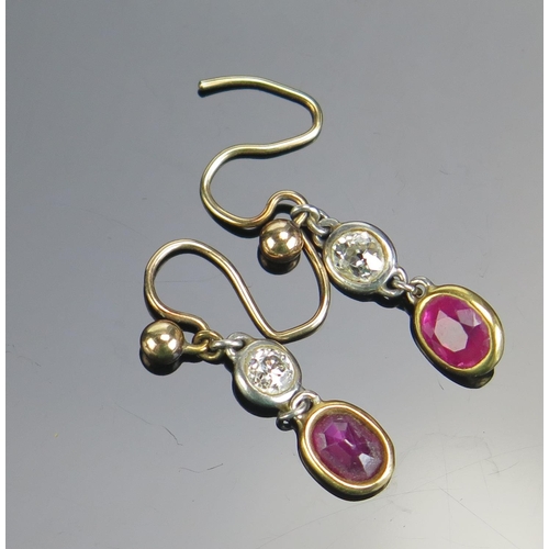 334 - A Pair of Ruby and Diamond Pendant Earrings in a precious white and yellow metal setting, 1.38g