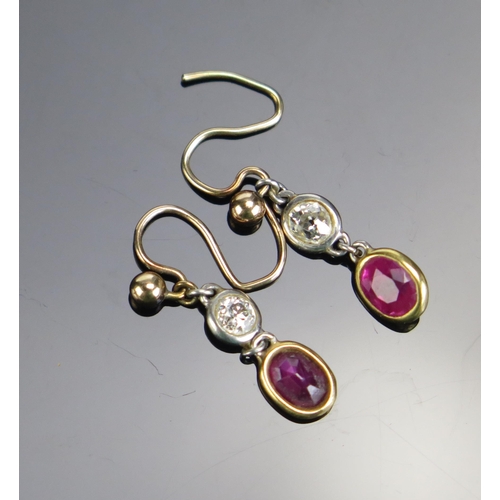 334 - A Pair of Ruby and Diamond Pendant Earrings in a precious white and yellow metal setting, 1.38g