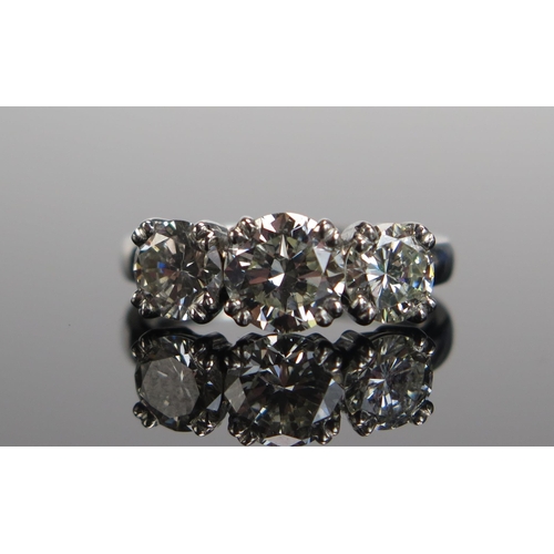 339 - A TIFFANY & CO. Platinum and Diamond Three Stone Ring, 6.9mm principal stone with 5.9mm shoulders, f... 