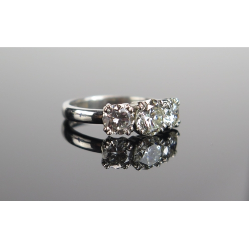 339 - A TIFFANY & CO. Platinum and Diamond Three Stone Ring, 6.9mm principal stone with 5.9mm shoulders, f... 