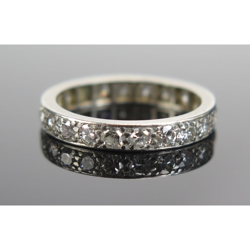 340 - A Diamond Eternity Ring in a precious white metal setting, c. 3.2mm wide, size M.5, probably 18ct, 3... 