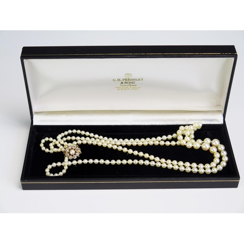 352 - A Graduated Pearl  or Cultured Pearl Twin Strand Necklace with 9ct gold and rose cut diamond clasp, ... 