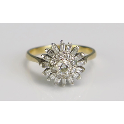 353 - An 18ct Gold and Diamond Cluster Ring, platinum set with brilliant and baguette cuts in a 13mm head,... 