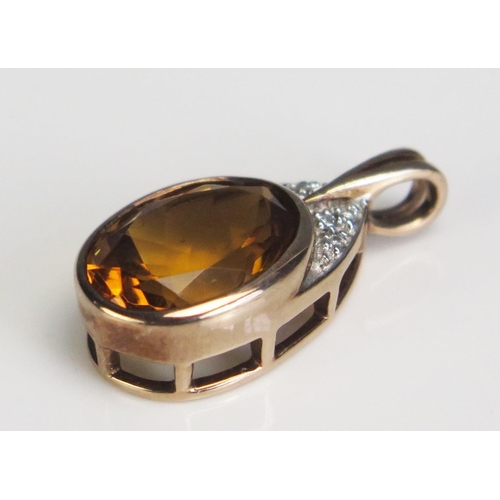 354 - A 9ct Rose Gold, Citrine and Diamond Pendant, 25.2mm drop, hallmarked, 4.2g