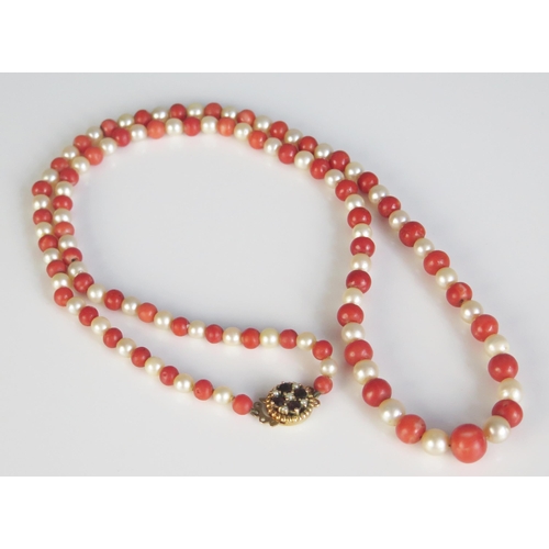 355 - A Coral and Pearl Necklace with a 9ct golf, garnet and pearl clasp, 54.4g