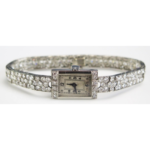 406 - A Diamond Set Cocktail Watch in a precious yellow metal setting (probably platinum or 18ct white), 2... 