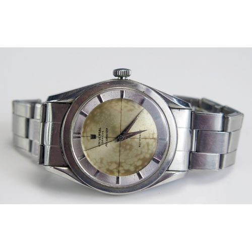 444 - A UNIVERSAL Gent's Automatic Steel Cased Wristwatch, 30.2mm case. Running, crown loose