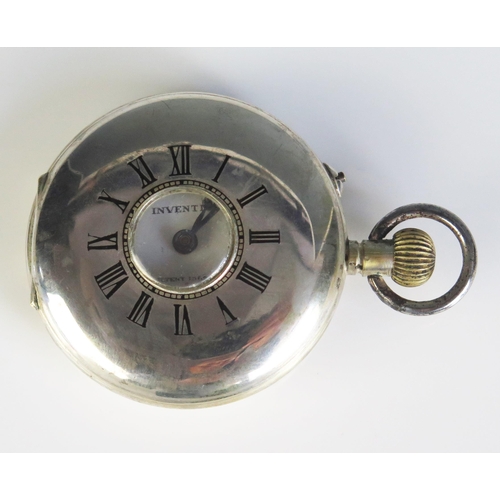 471 - An INVENTIC Shock Proof Half Hunter Pocket Watch in a white metal case