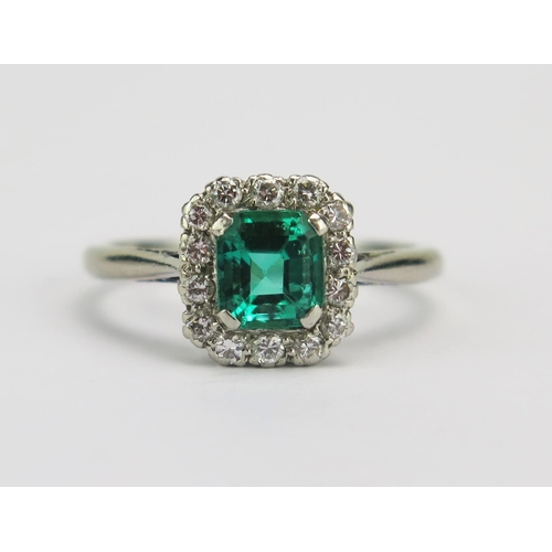 A Platinum, Emerald and Diamond Ring, 5.05x4.55mm principal stone surrounded by c. 0.8mm brilliant cuts, 8.94x8.7mm head, size K, maker Cropp & Farr, stamped PLATINUM, 3.87g