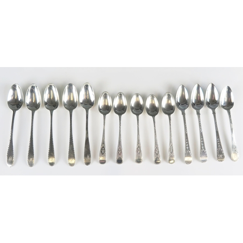 511 - A collection of assorted silver Old English pattern teaspoons, with bight cut decoration, some initi... 