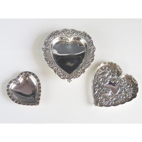 527 - Three assorted silver heart-shaped dishes, various makers and dates, 12cm, 10cm and 7cm wide, total ... 