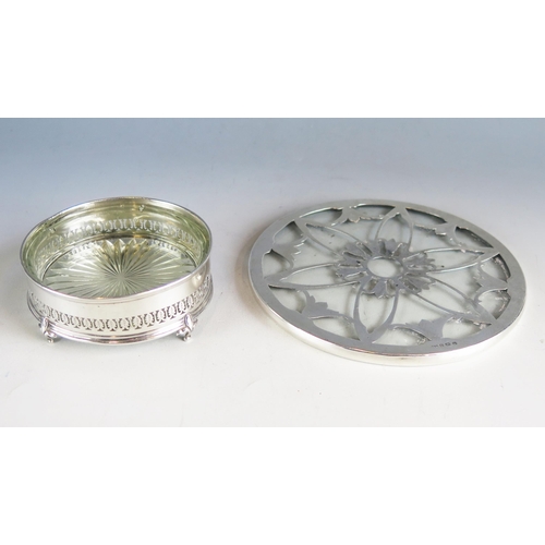 537 - A clear glass and silver mounted teapot stand of circular form, 15cm diameter, together with a clear... 