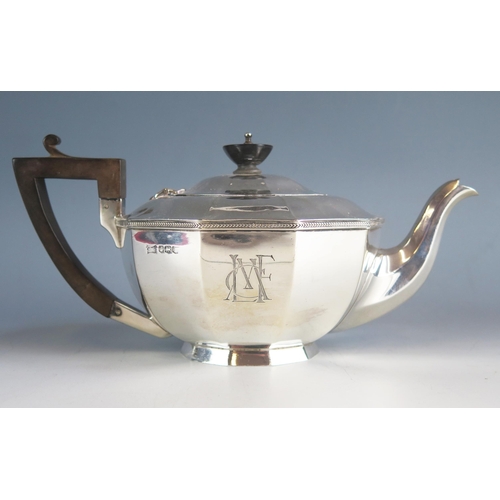 540 - A George V silver teapot, maker Walker & Hall, Sheffield, 1928, monogrammed, of polygonal tapering f... 