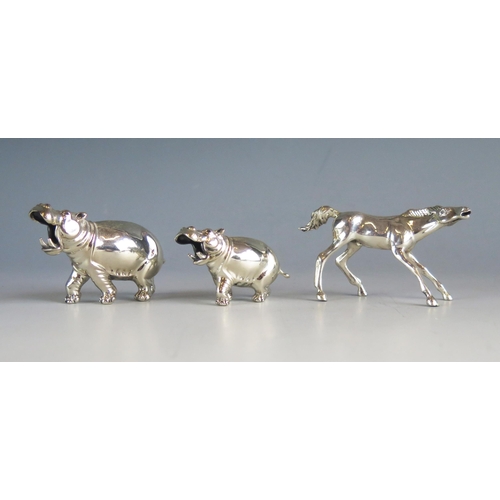 542 - A silver model of a hippopotamus, stamped marks, 8cm long, another similar smaller model 6cm long an... 