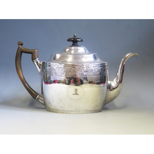 546 - A George III silver teapot, maker George Eadon & Co, Sheffield, 1804, crested, oval outline, with ba... 