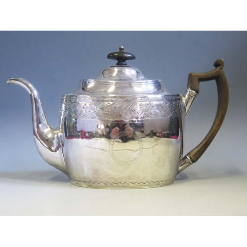 546 - A George III silver teapot, maker George Eadon & Co, Sheffield, 1804, crested, oval outline, with ba... 