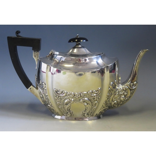 549 - An Edward VII silver teapot, maker Jones & Crompton, Birmingham, 1905, of oval outline, with embosse... 