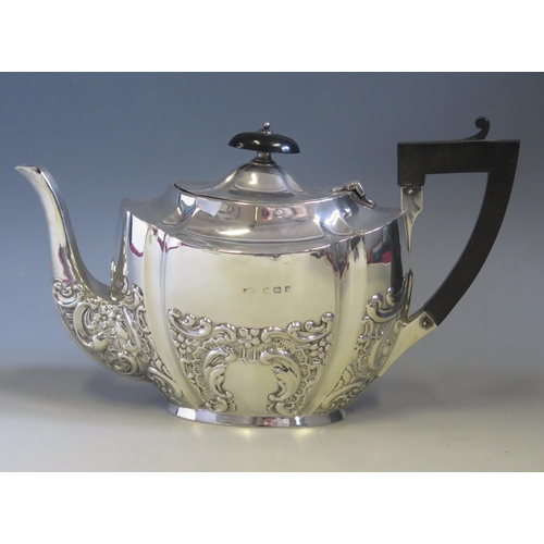 549 - An Edward VII silver teapot, maker Jones & Crompton, Birmingham, 1905, of oval outline, with embosse... 