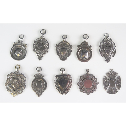 556 - A collection of silver fobs and sporting medallions, various makers and dates, total weight of silve... 