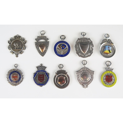 557 - A collection of silver fobs and sporting medallions, various makers and dates, total weight of silve... 