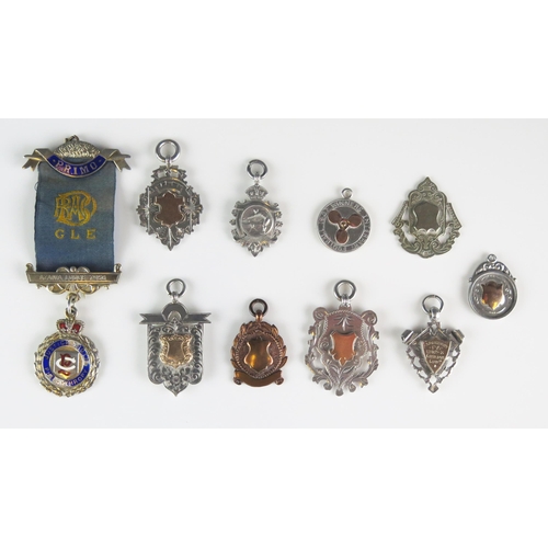 558 - A collection of silver and bronze fobs, jewel and sporting medallions, various makers and dates, tot... 