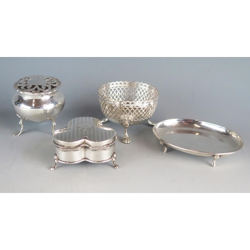 559 - A mixed collection of silver various makers and dates includes a trefoil-shaped ring box on swept fe... 