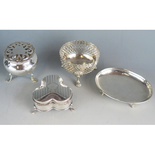 559 - A mixed collection of silver various makers and dates includes a trefoil-shaped ring box on swept fe... 