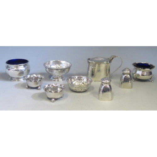 567 - A mixed collection of silver condiments, various makers and dates, includes salts , mustard pot and ... 