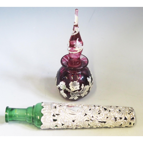 591 - A continental purple glass and silver mounted scent bottle, of globular form with banded floral deco... 