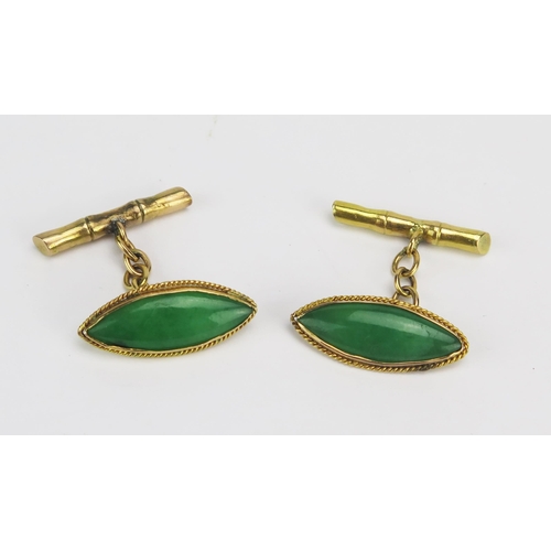 61 - A Pair of 18ct Gold and Jadeite Cufflinks, 24.3mm long heads with faux bamboo retaining bars, stampe... 