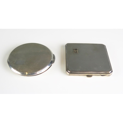 610 - A circular silver powder compact, together with a square example, initialled, (2).