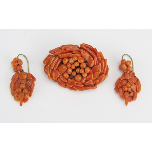 63 - A Coral Brooch (49.9x35.5mm) and a pair of earrings, 21.7g