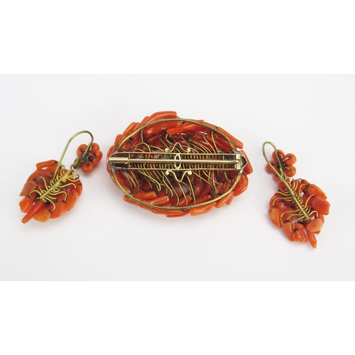 63 - A Coral Brooch (49.9x35.5mm) and a pair of earrings, 21.7g