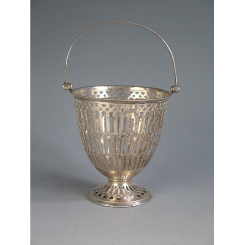 637 - A George V silver swing handled cream pail, maker's mark worn Birmingham, 1935, with beaded handle a... 