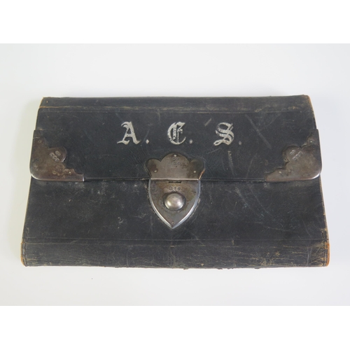 652 - A Victorian leather and silver mounted wallet, maker RK, London, 1892, 15cm wide.