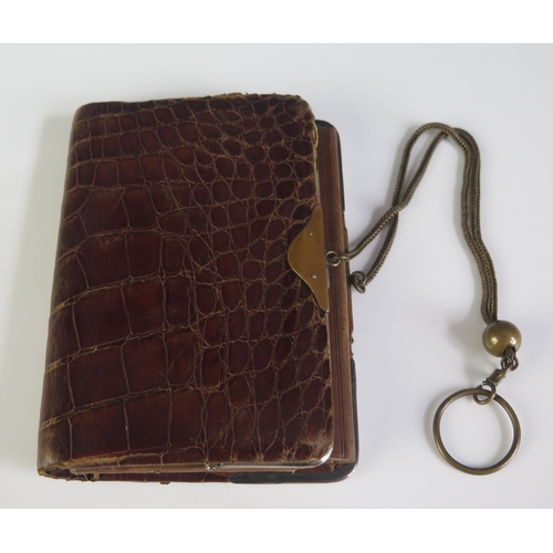 655 - An Art Nouveau period faux crocodile skin and silver mounted purse, bears import marks for Birmingha... 